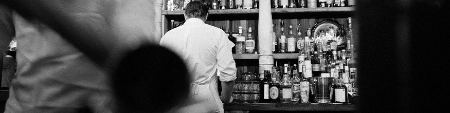 black and white photo of a bar